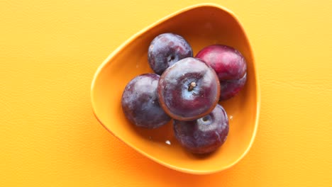 plums in a bowl