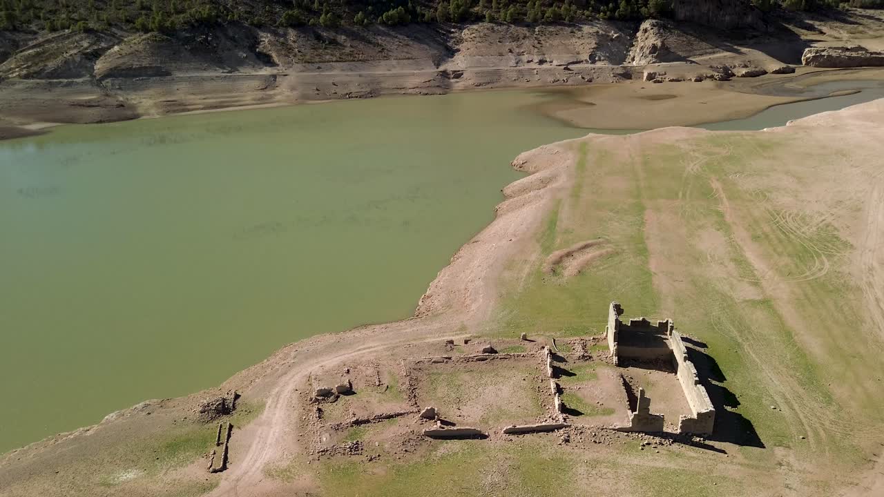 Aerial View of Abandoned Ruins Near a Drying Reservoir
