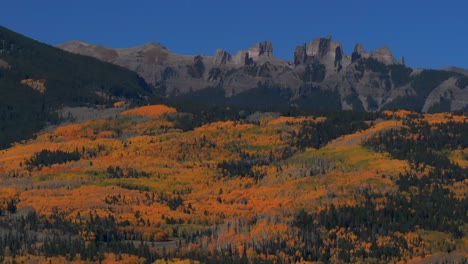 fall autumn auburn full peak colors castle mountain aerial drone colorado ohio kebler swampy pass crested butte aspen trees gunnison national forest morning sunny blue sky parallax circle right motion