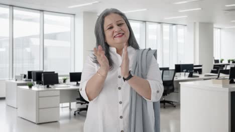 Happy-Indian-senior-businesswoman-clapping-and-appreciating