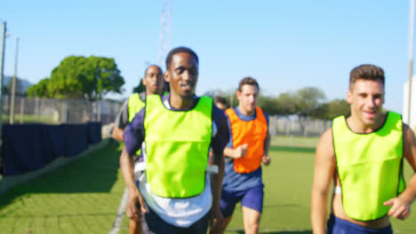 soccer players running in the field 4k