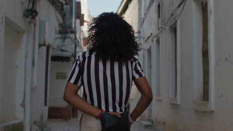 young man walks in the streets of old town