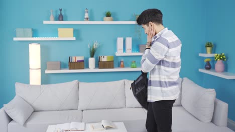 Angry-young-man-angry-with-himself-comes-home-frustrated.