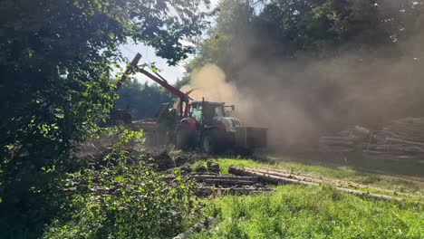 Farmer-using-heaving-machinery-to-cut-down-and-remove-overgrown-trees