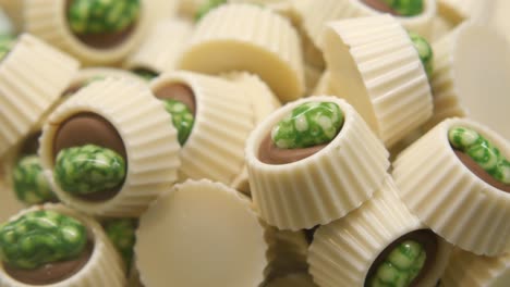 assortment of white chocolate truffles with green candies