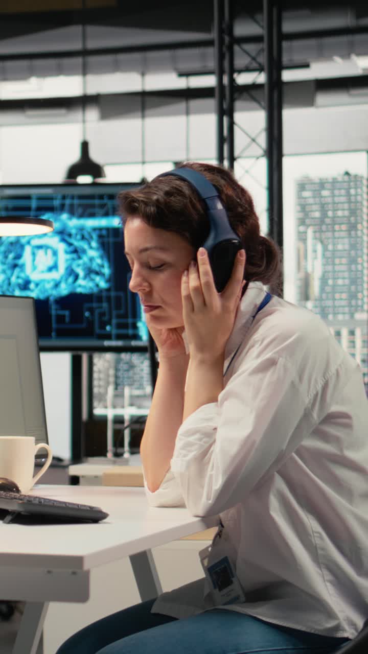 Vertical video Developer listening music while working in AI startup