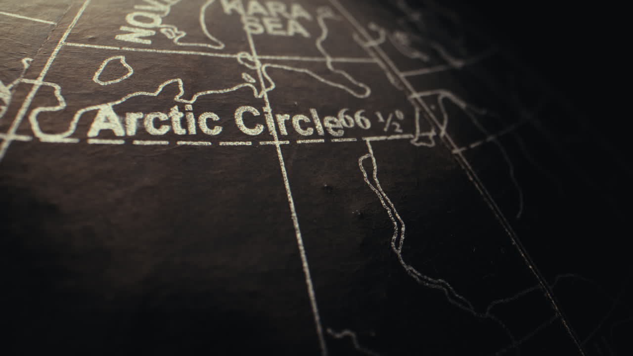 Close-up of the Arctic Circle on a vintage globe