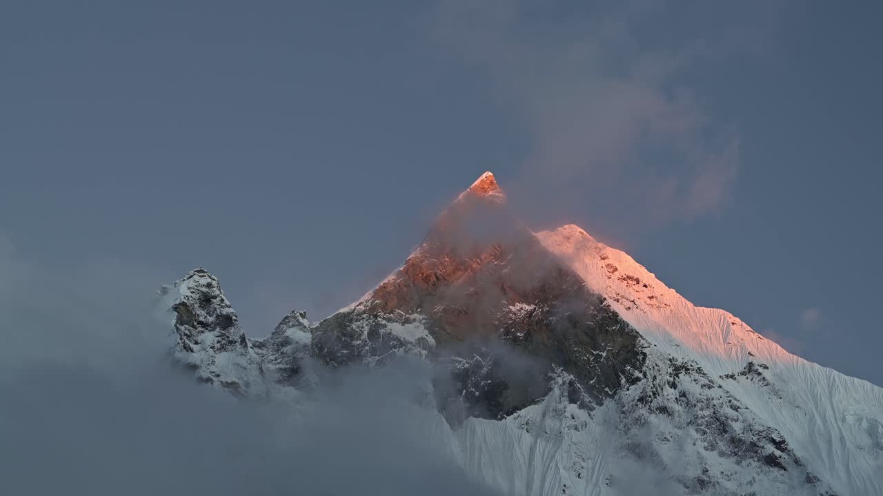 Snowcapped Mountains Summit Background at Sunset with Copy Space, Pointy Pointed Mountain Top in Beautiful Dramatic Last Light at Sunset, Tall High Big Massive Mountain Peaks Background