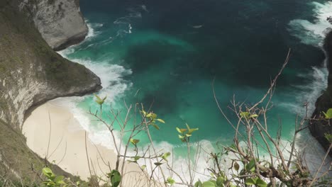 aerial view of the tourist hotspot kelingking beach on nusa penida, indonesia on a sunny day and with crystal blue water