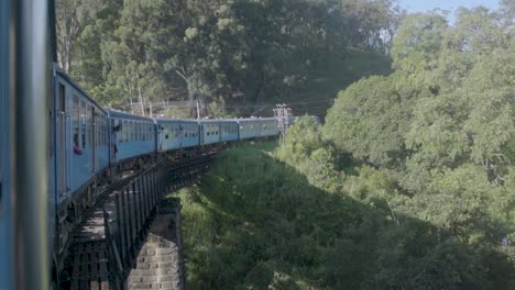 point of view, famous sri lankan blue train crossing a bridge, kandy to ella
