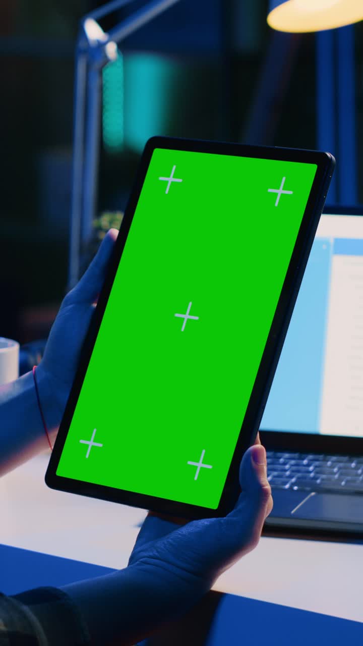 Vertical video Man working from home doing project research, typing on mockup tablet