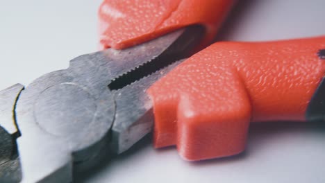 cutting-pliers-lie-on-white-background-extreme-close-view