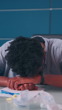overwhelmed student struggles with stress in a cluttered study space