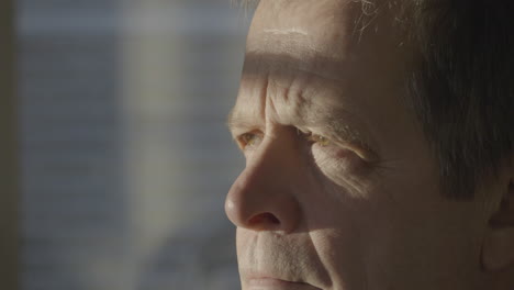 close-up of an elderly caucasian man denying with his head