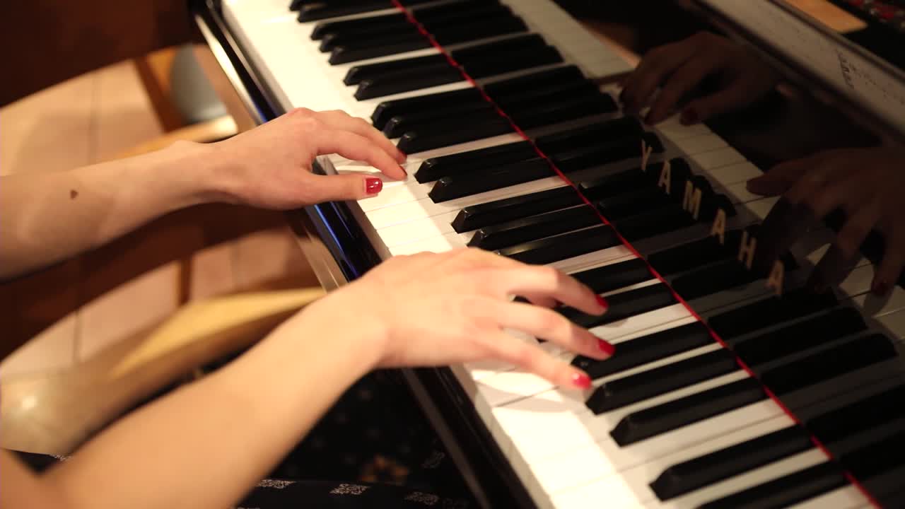 Woman Hands Playing Piano Beautifully