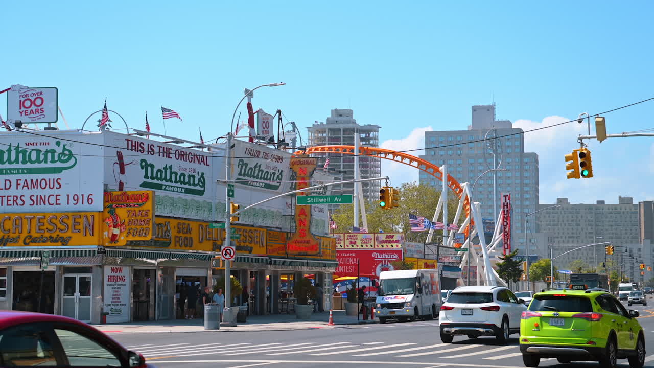 New York, USA, 1 August 2025: Nathan's Famous at Coney Island, New York. The historic Nathan's Famous hot dog stand with bright signs at Coney Island in New York City