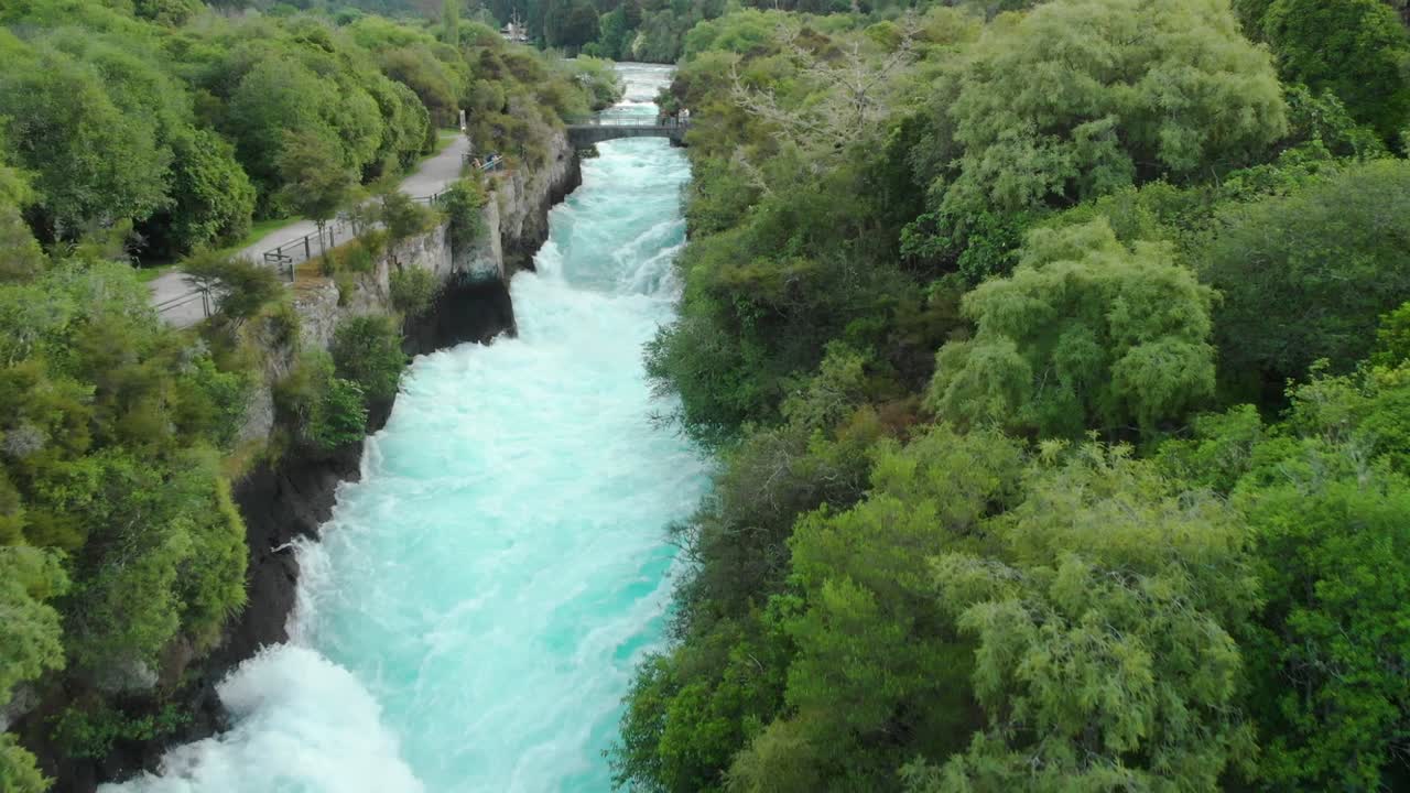 Aerial drone flying upstream over Huka Falls on Waikato River near Taupo in New Zealand