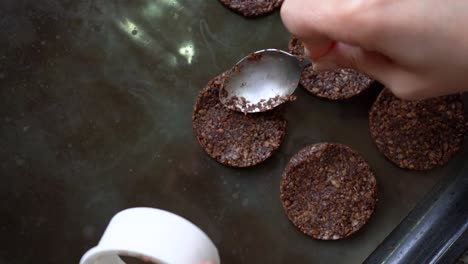 molding homemade cookies into oven tray. close up