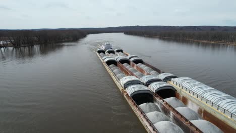 a towboat pushes barges north on the mississippi river-1