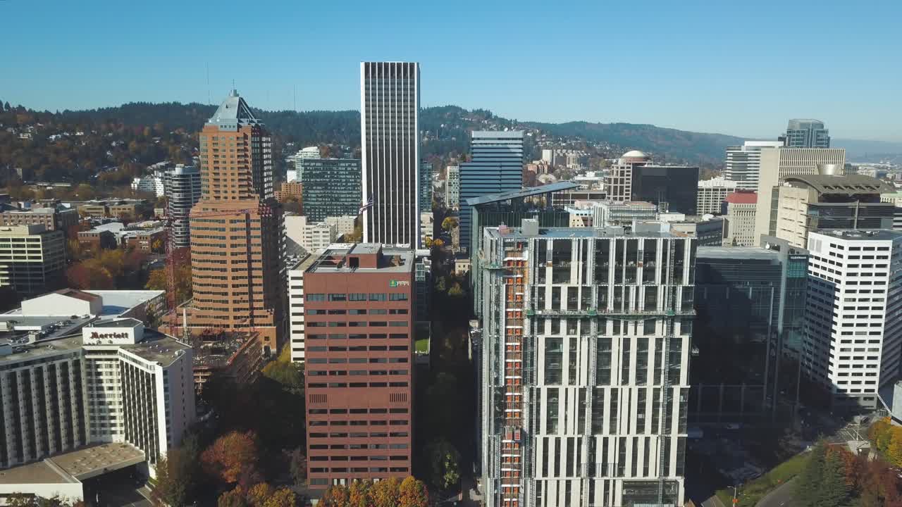 Stunning aerial shot of the city skyline of Portland in Oregon - Drone 4k birds eye view - Financial district and office buildings in downtown - USA