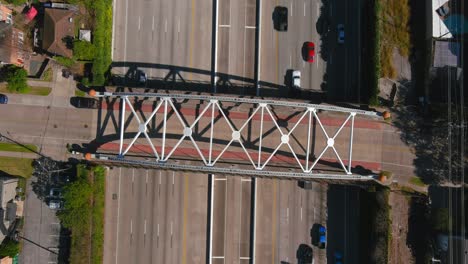 Aerial-of-cars-on-59-South-freeway-in-Houston,-Texas-on-a-bright-sunny-day