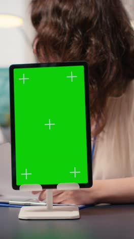 vertical video businesswomen attend meeting in the office with a mockup display