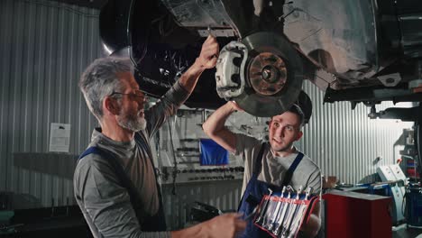 car repair and maintenance by two skilled mechanics