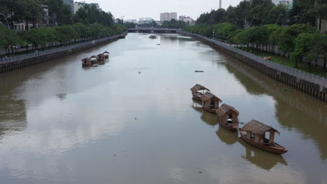 flying along a ho chi minh city canal in binh thanh district