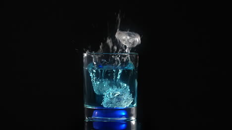 blue cocktail with ice splash