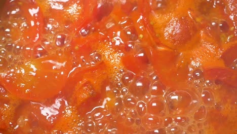 boiling tomatoes in a pot