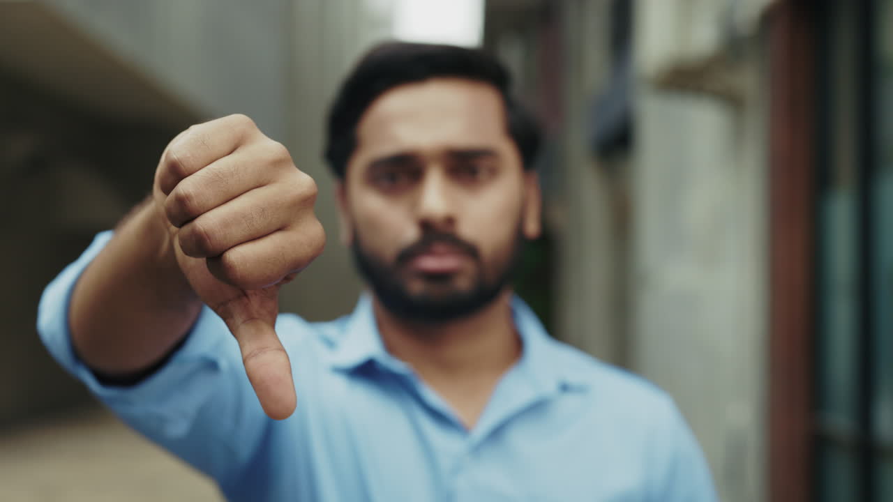 Man giving thumbs down