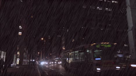 Traffic-moves-along-New-York's-Fifth-Ave-at-night-during-a-major-rainstorm