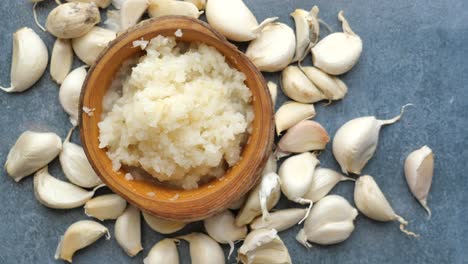 minced garlic in wooden bowl