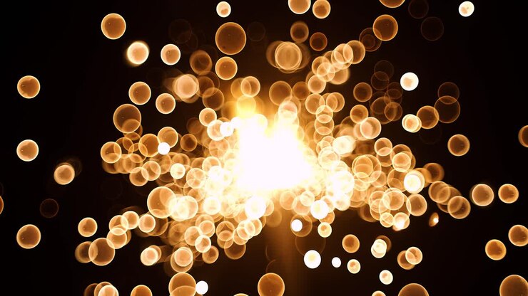 Particelle astratte di bokeh dorato a bolle che volano su sfondo nero. Polvere di particelle bokeh oro rosso arancio che volano nell'aria con telecamera super slow motion a 1000 fps