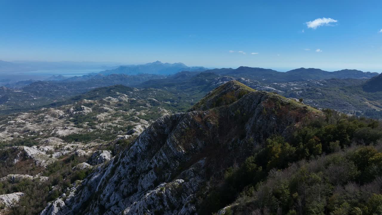 Rocky Peak Of Lovcen Mountain In Daytime In Montenegro. - aerial shot