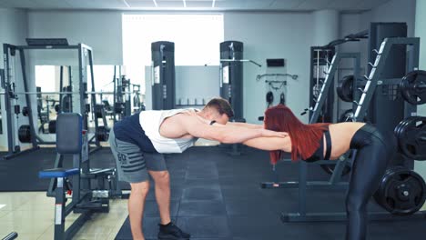 couple working exercise together. young sporty couple working out together at gym