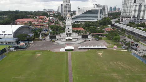 aerial drone pullout shot low angle of jam besar dataran in johor bahru, malaysia