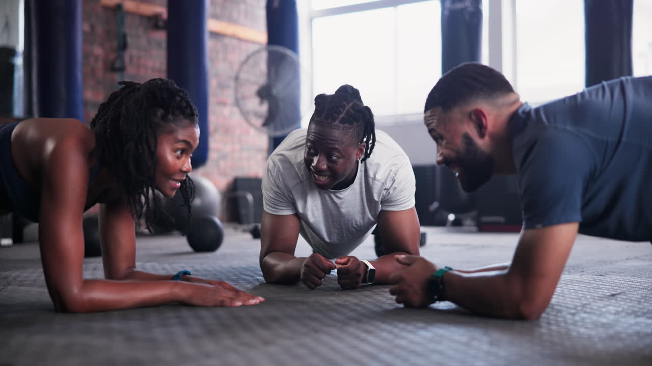 Group Plank Exercise in Gym