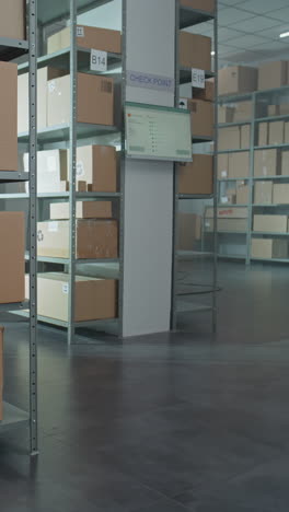 warehouse interior with storage shelves and monitor