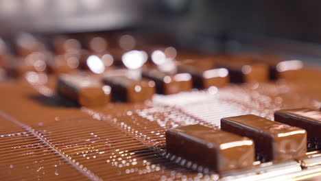 tasty chocolate conveyor deserts. sweet candies manufacturing on production line.