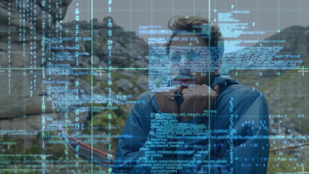 Scroll code overlay drifting revealing man scanning rocky pass analyzing tech data on device
