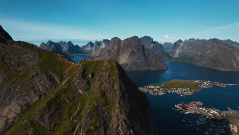 reinebringen viewpoint above coastal village reine, lofoten, norway. surrounded by mountains, arctic sea