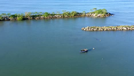 fisherman in soco river mouth with fishing criminal method, dominican republic