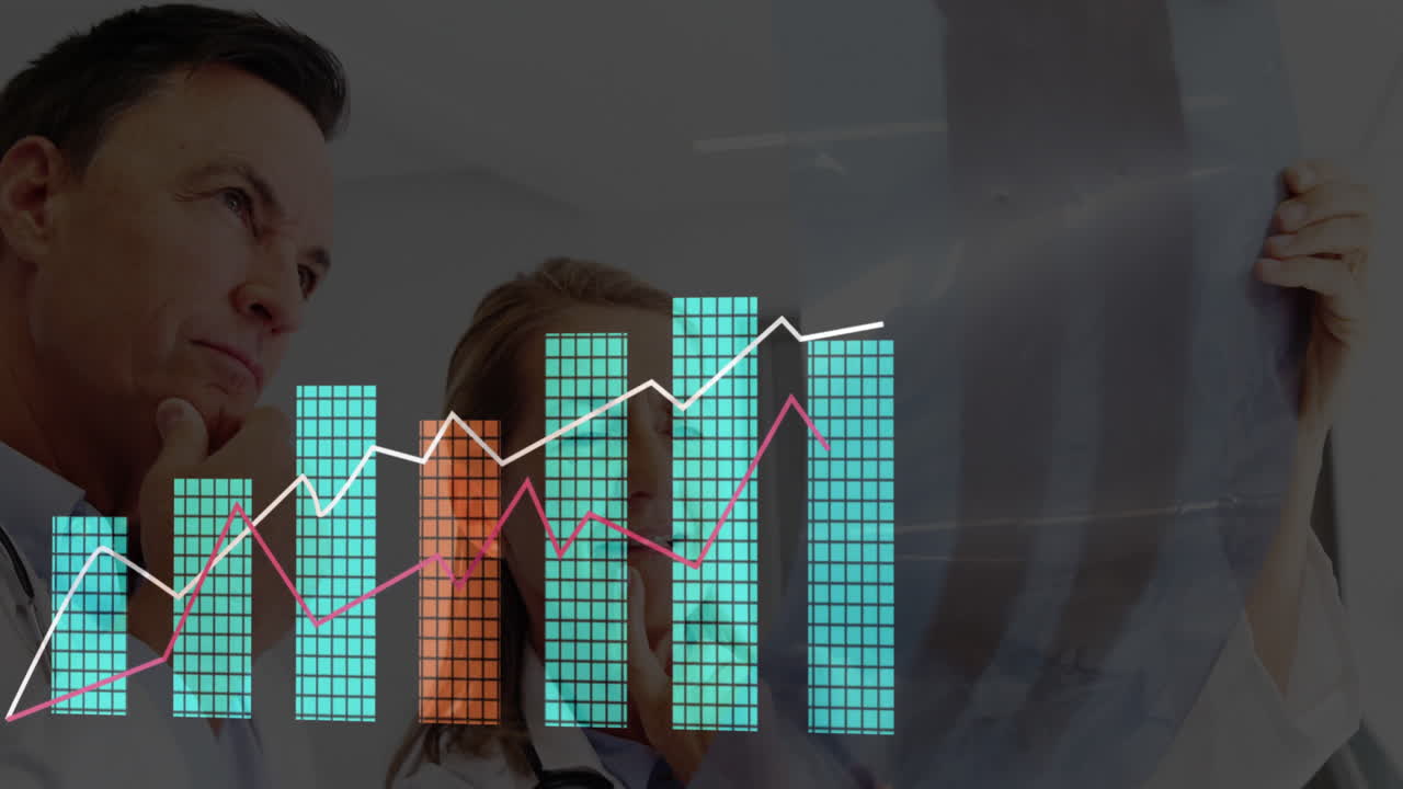 Female doctor holding X-ray film in exam room, male doctor studying bar and line graph overlay