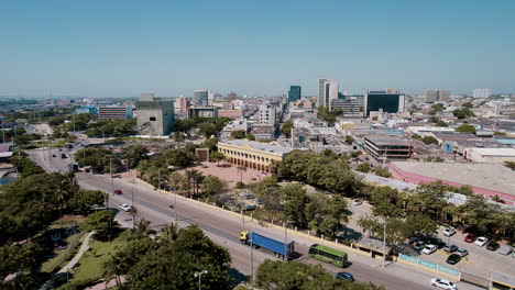 aerial view of plaza de la aduana, cars driving on the road below, vibrant cityscape adds to the dynamic charm of the scene