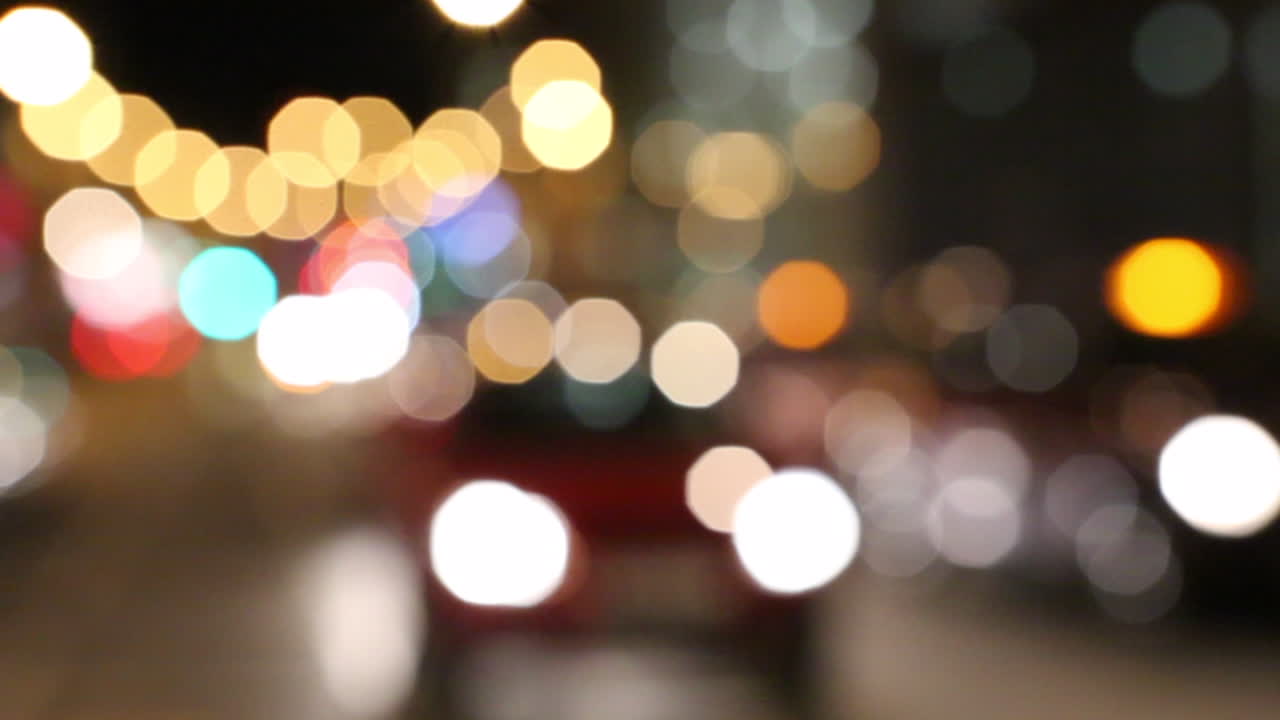 Beautiful Bokeh of Car Lights in London at Night. Magic Moving Cars Out of Focus