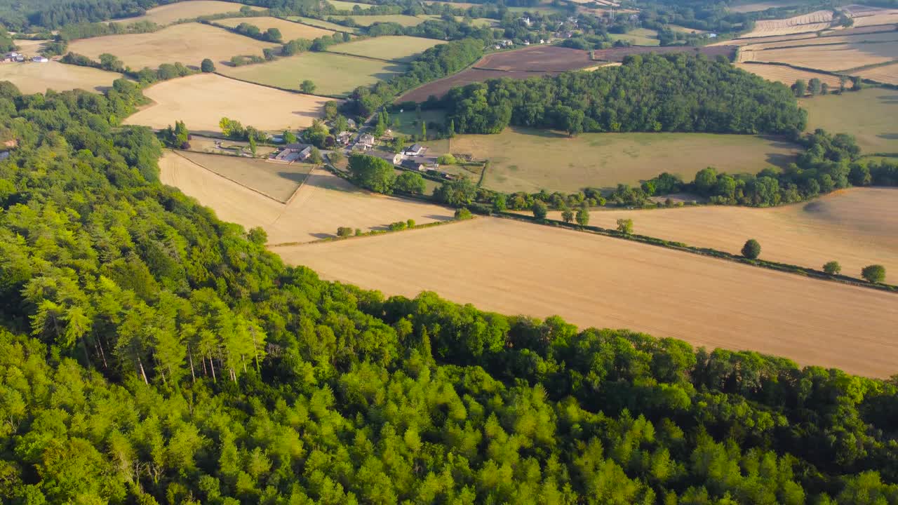 Rotating Panning Aerial View Across Farmed Ploughed Fields in Evening Sunlight in Forest of Dean in British English Countryside. Exampel of Beautiful Rural Landscape in England