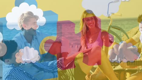 Animation-of-colourful-puzzle-pieces-over-happy-friends-at-summer-beach-party