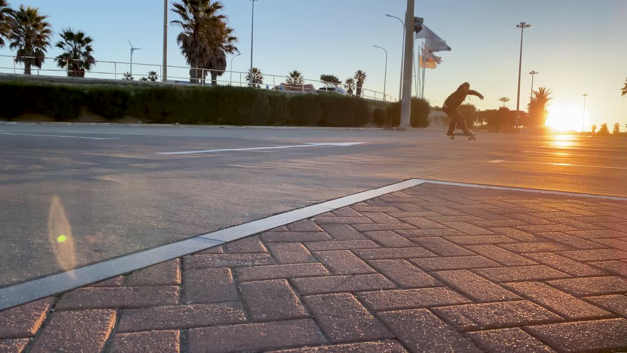 A skater carves through the streets at sunrise, his silhouette striking against the golden sun rays