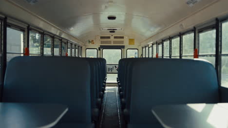 empty seats placed school bus interior closeup. safety transport concept.